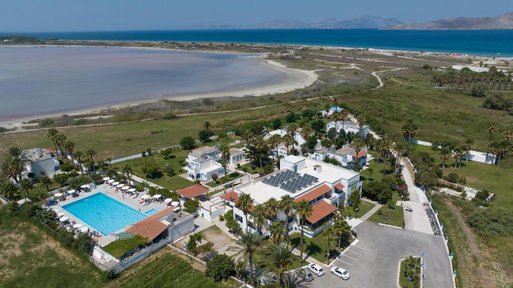 an aerial view of a resort with a pool and a beach at Hotel Tigaki's Star in Tigaki
