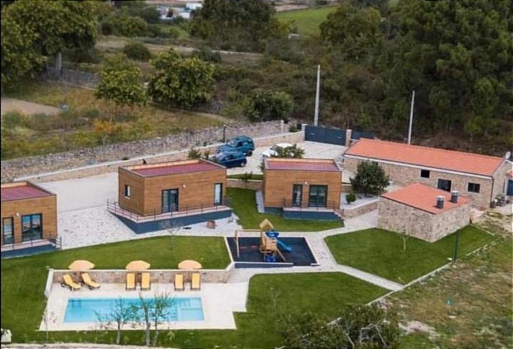 an aerial view of a house with a swimming pool at Trancoso Ecohouse in Trancoso