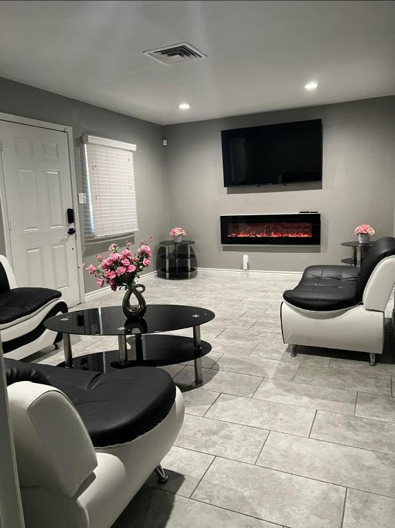a living room with couches and a fire place at Charming and Cozy Place in Las Vegas