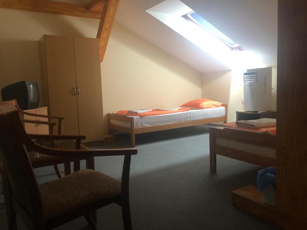 Postel nebo postele na pokoji v ubytování City Hotel Siófok