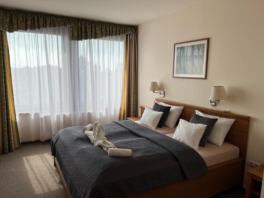 Postel nebo postele na pokoji v ubytování Hotel Estella Superior
