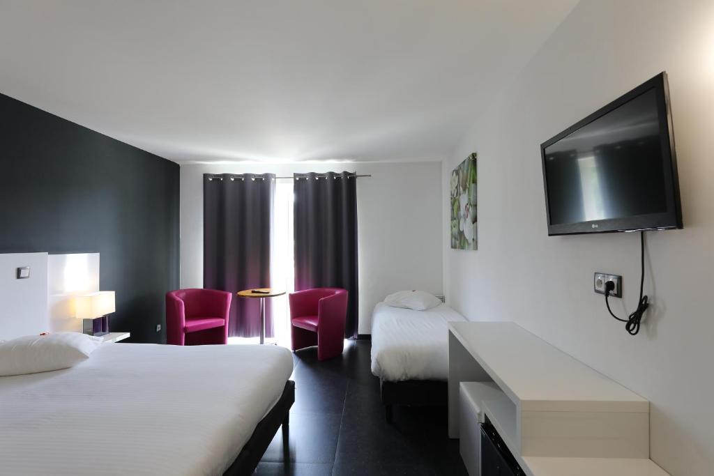 Postel nebo postele na pokoji v ubytování Hotel Bô Rivage