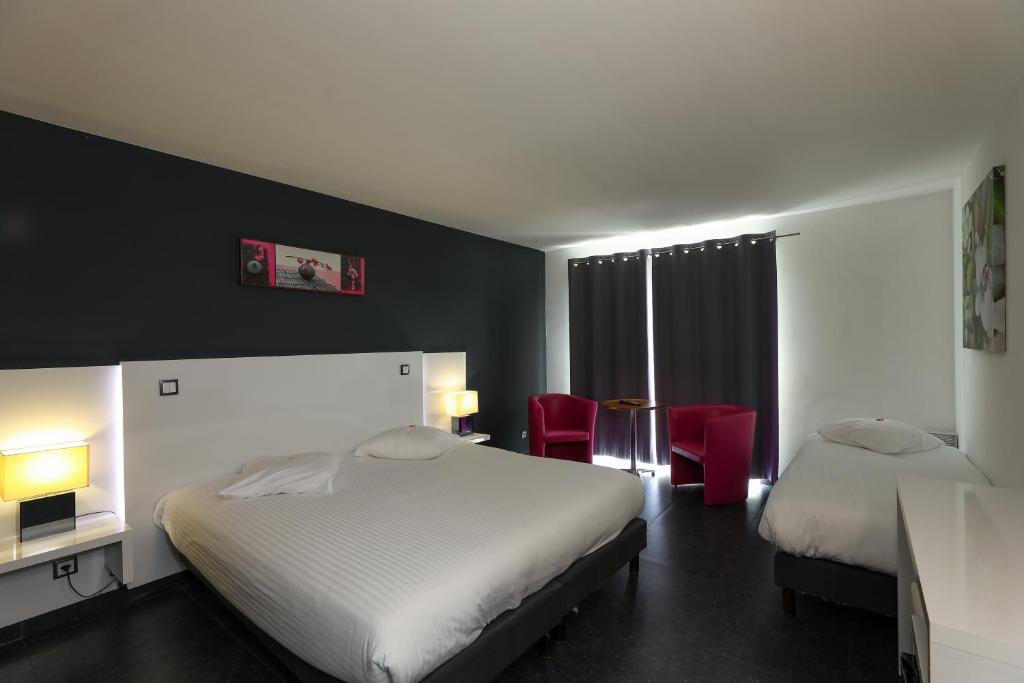 Postel nebo postele na pokoji v ubytování Hotel Bô Rivage