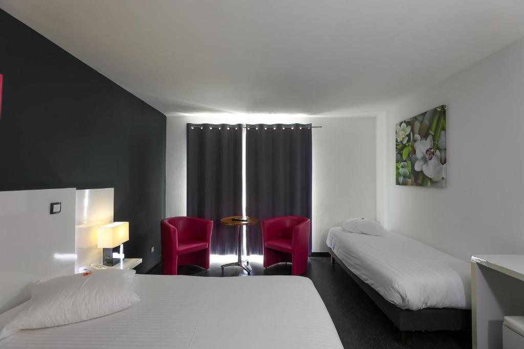 Postel nebo postele na pokoji v ubytování Hotel Bô Rivage