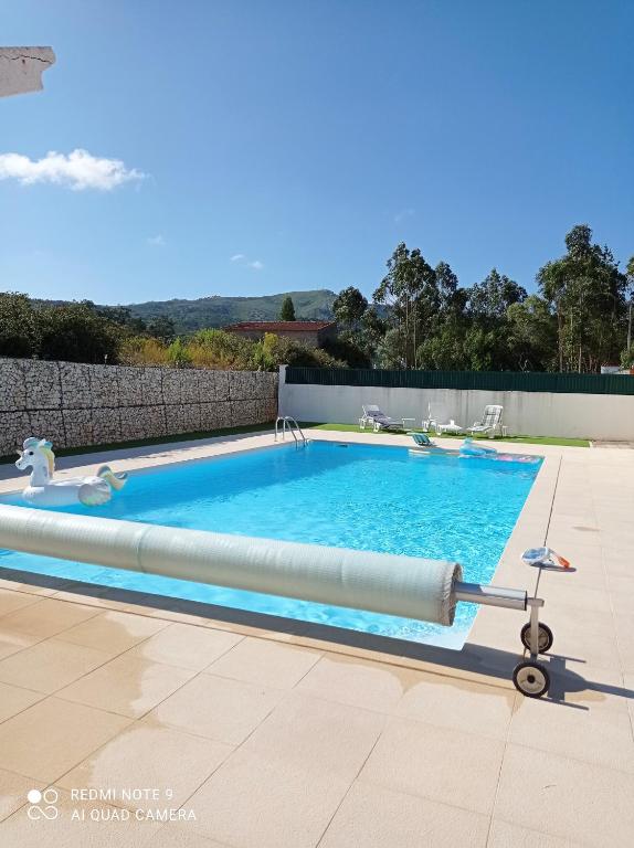 a large swimming pool with aicrobialicrobialicrobial at chez Sylvie et Alain in Lamas