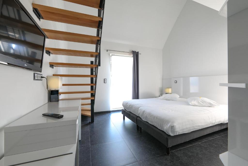 Postel nebo postele na pokoji v ubytování Hotel Bô Rivage