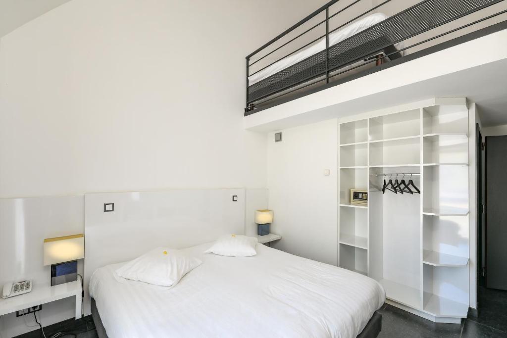 Postel nebo postele na pokoji v ubytování Hotel Bô Rivage