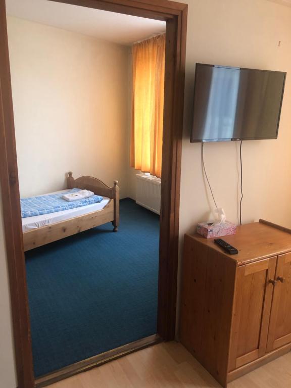 Postel nebo postele na pokoji v ubytování City Hotel Siófok
