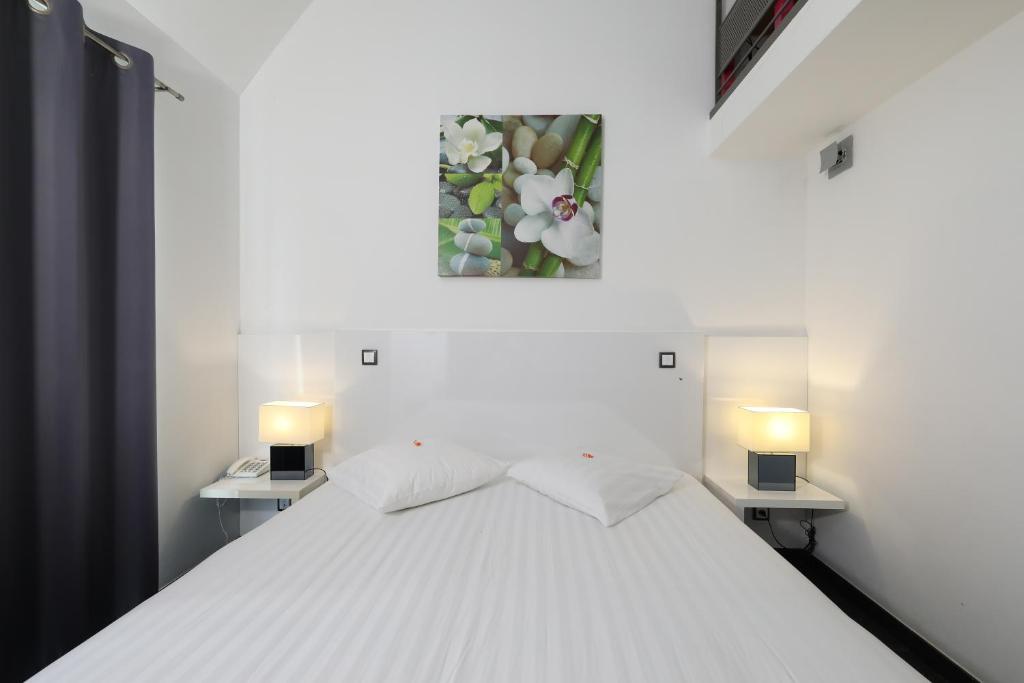 Postel nebo postele na pokoji v ubytování Hotel Bô Rivage