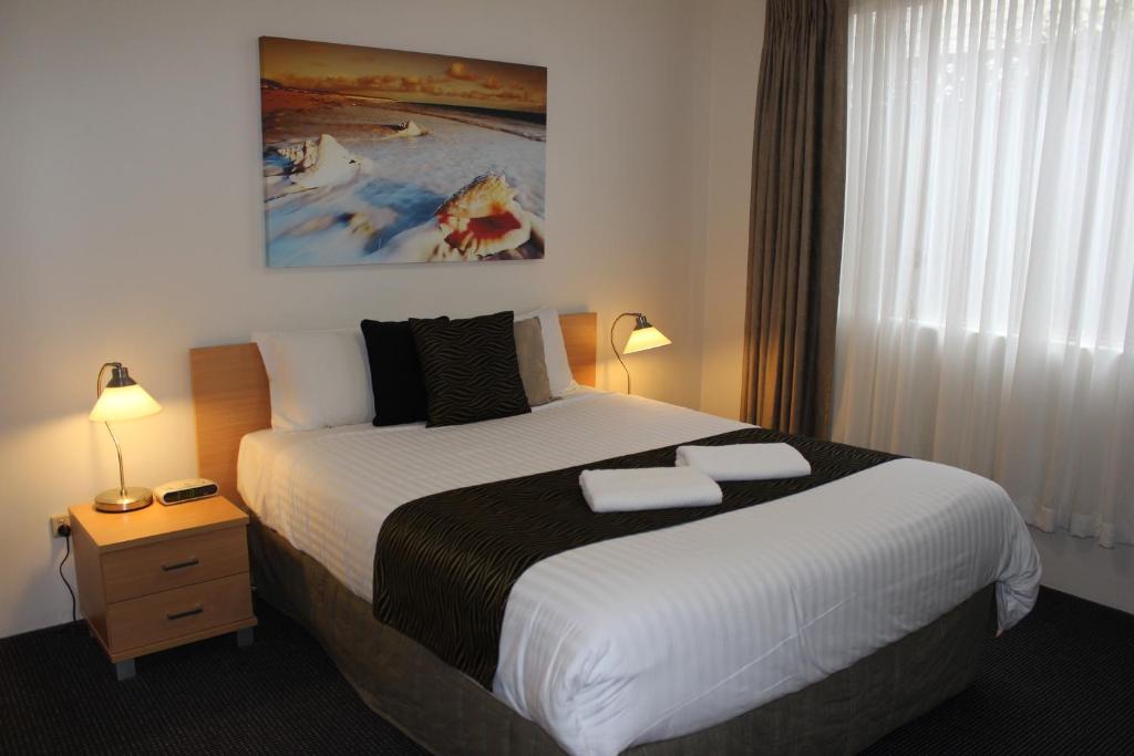 Postel nebo postele na pokoji v ubytování Beaches Serviced Apartments