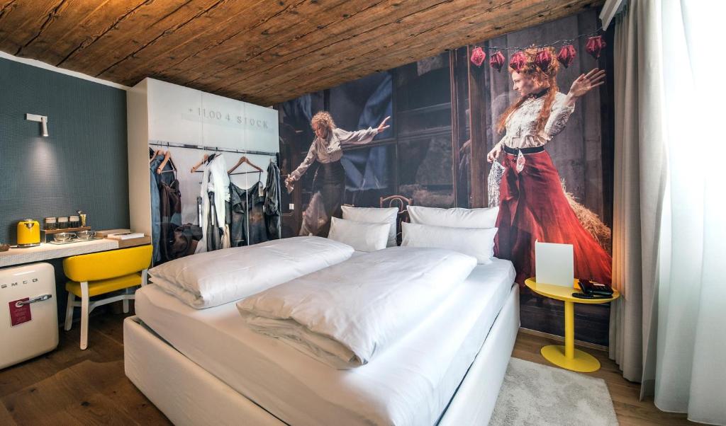 Postel nebo postele na pokoji v ubytování Small Luxury Hotel Goldgasse