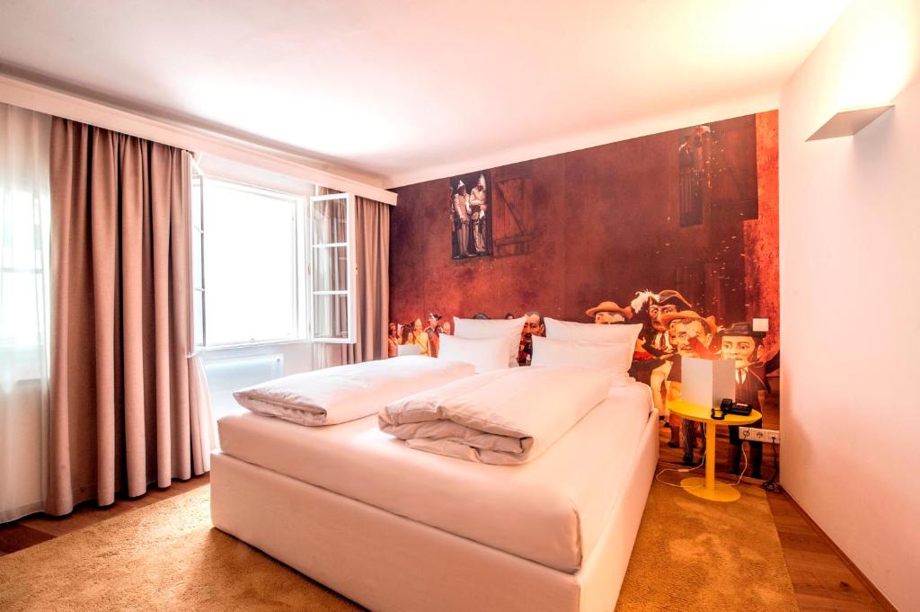 Postel nebo postele na pokoji v ubytování Small Luxury Hotel Goldgasse