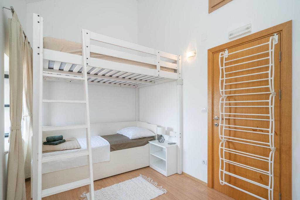 Posteľ alebo postele v izbe v ubytovaní Holiday Home Majkovi