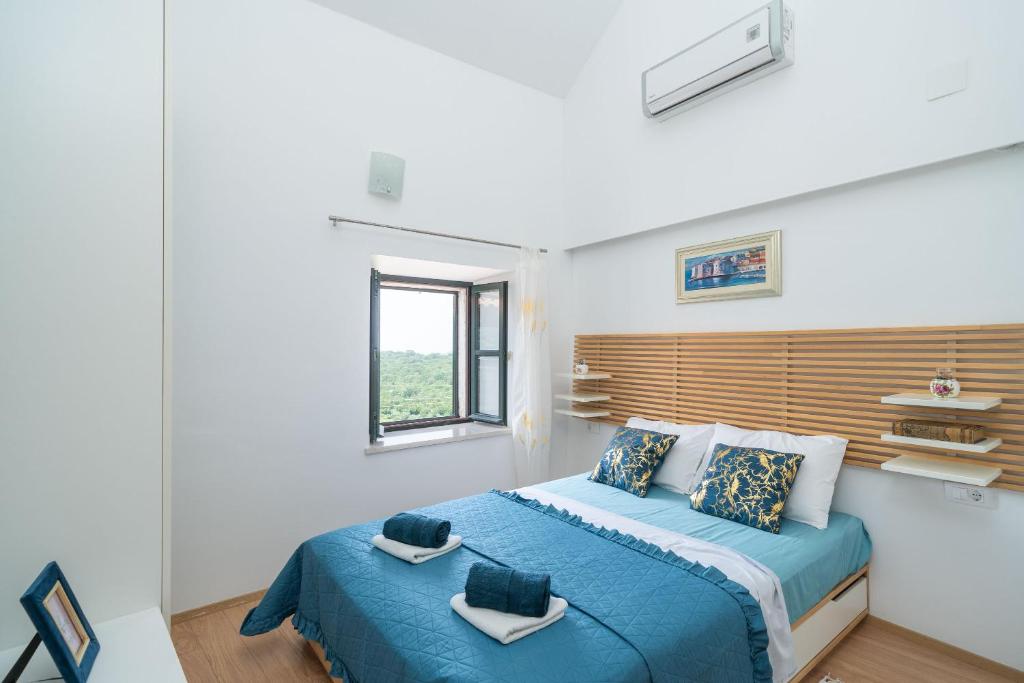 Posteľ alebo postele v izbe v ubytovaní Holiday Home Majkovi