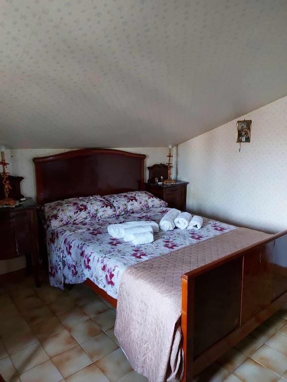 Postel nebo postele na pokoji v ubytování Luciano e Concetta