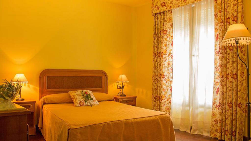 Cama o camas de una habitación en Alojamiento Calzada Romana