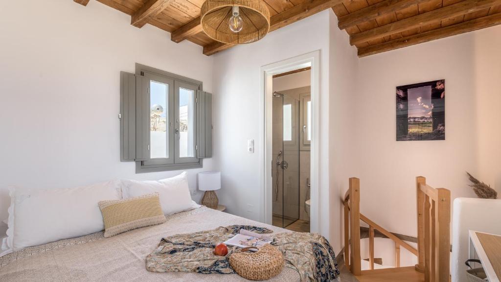 a bedroom with a bed in a room at Studios Betty in Plaka Milou