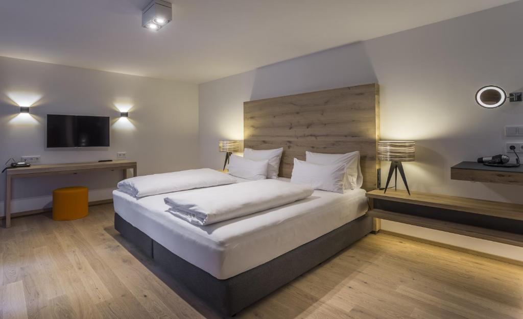 Postel nebo postele na pokoji v ubytování Das Graseck - mountain hideaway & health care