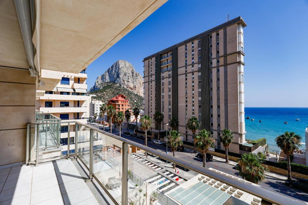 a view of the ocean from the balcony of a hotel at SOTAVENTO BEACH in Calpe