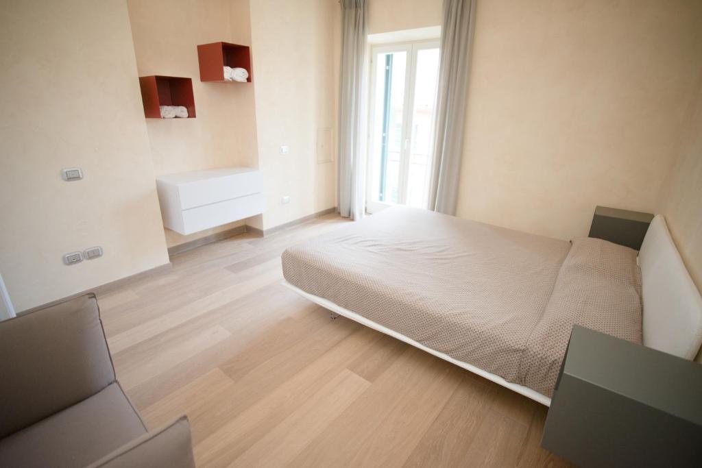Posteľ alebo postele v izbe v ubytovaní Lazise Boutique Apartment Lago e Relax