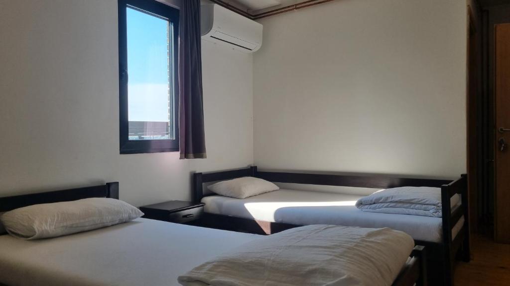 Postel nebo postele na pokoji v ubytování B&B Botel Charlie