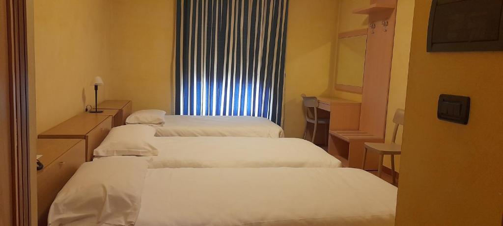 Posteľ alebo postele v izbe v ubytovaní Hotel Ceretto