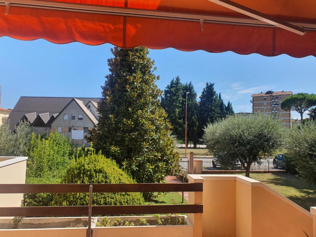 a view of a tree from a balcony at Villa Elsa, Cesena zona Ippodromo in Cesena