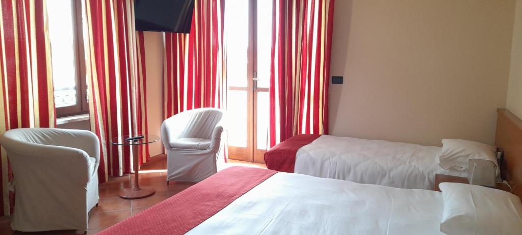 Posteľ alebo postele v izbe v ubytovaní Hotel Ceretto