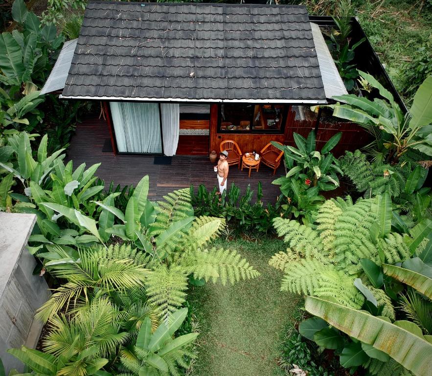 an aerial view of a garden with a house at Kabinji Bali in Tampaksiring