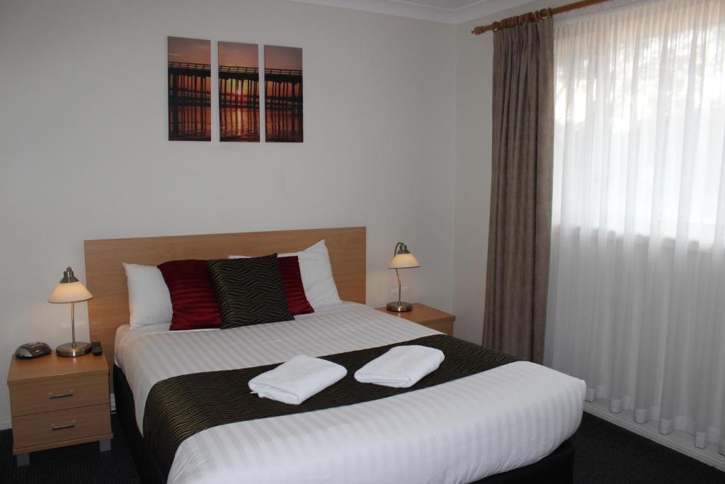 Postel nebo postele na pokoji v ubytování Beaches Serviced Apartments