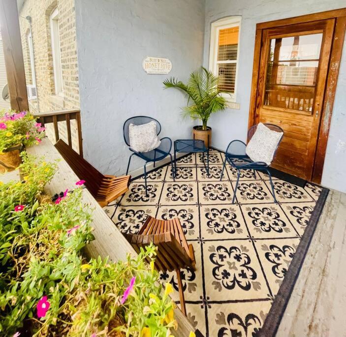 a porch with two chairs and a tile floor at Beautiful Chicago 2BD 1BA in Chicago