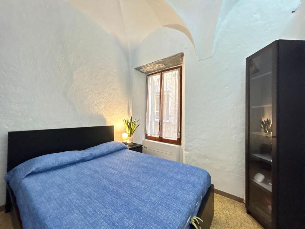 Ein Bett oder Betten in einem Zimmer der Unterkunft [La Finestra sul Borgo] - Cervo