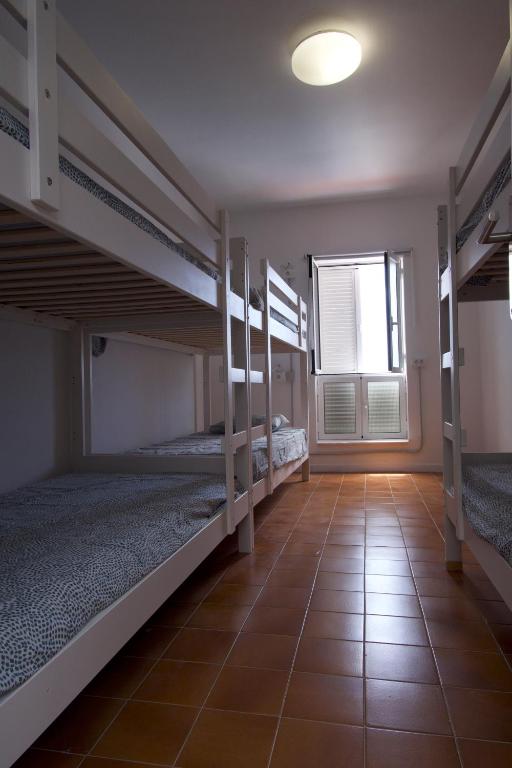 Postel nebo postele na pokoji v ubytování Las Eras Nest Hostel