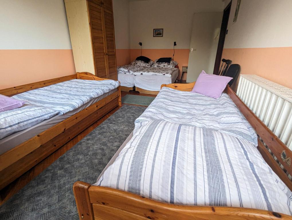 Posteľ alebo postele v izbe v ubytovaní Várkapitány-lak