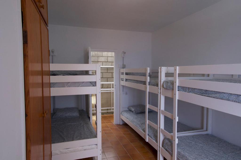 Palanda nebo palandy na pokoji v ubytování Las Eras Nest Hostel