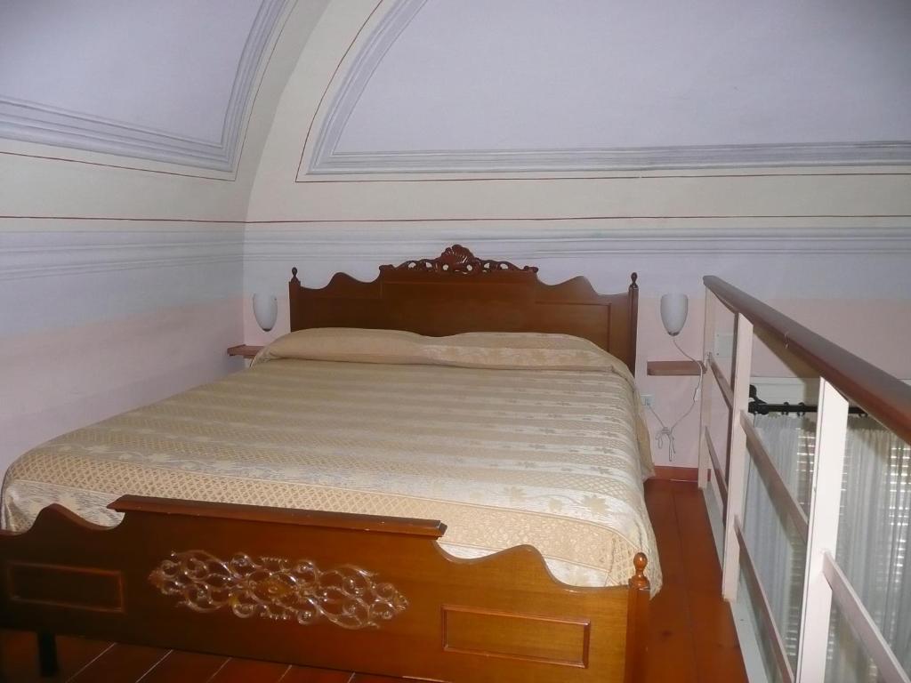 Postel nebo postele na pokoji v ubytování I Papiri B&B Aparthotel