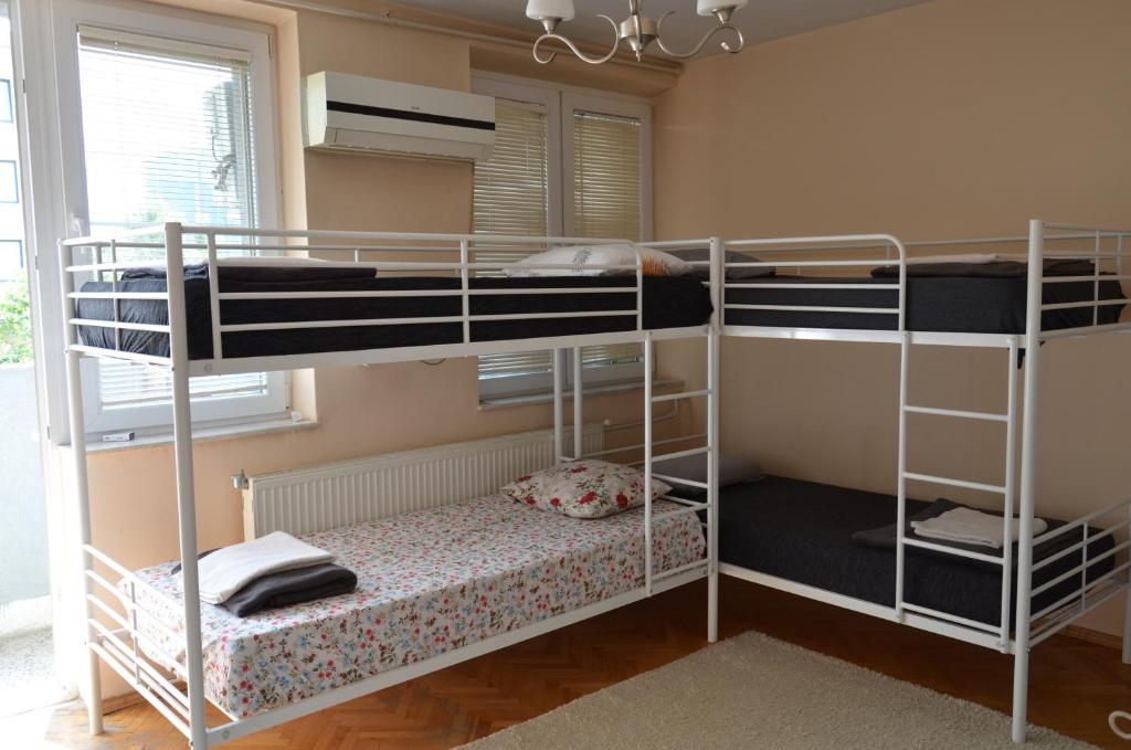 a bunk bed room with two bunk beds at Center House Hostel in Prishtinë