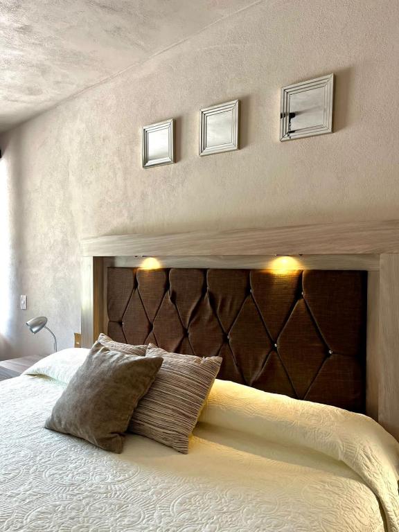 Postel nebo postele na pokoji v ubytování Cabañas, Suites y Habitaciones Rancho San Jorge