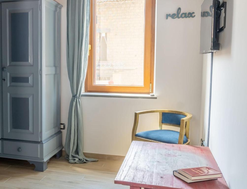 Postel nebo postele na pokoji v ubytování Palazzo NiTe