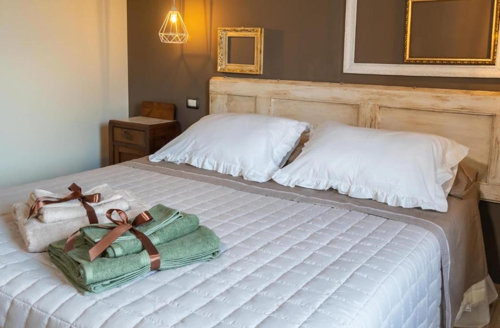 Postel nebo postele na pokoji v ubytování Palazzo NiTe