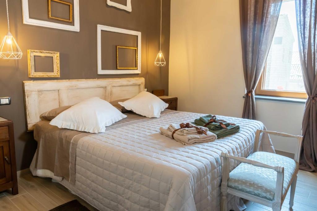 Postel nebo postele na pokoji v ubytování Palazzo NiTe