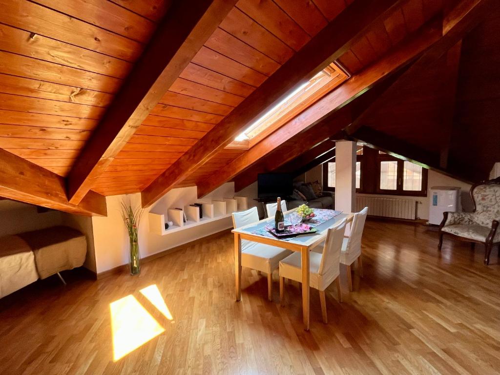 a dining room with a table and chairs in a room at Paradise - nature and wellness in Pino Torinese