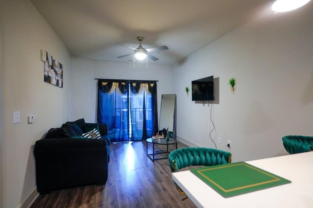 a living room with a couch and a table with chairs at COZY 1 bed/1 bath in Atlanta