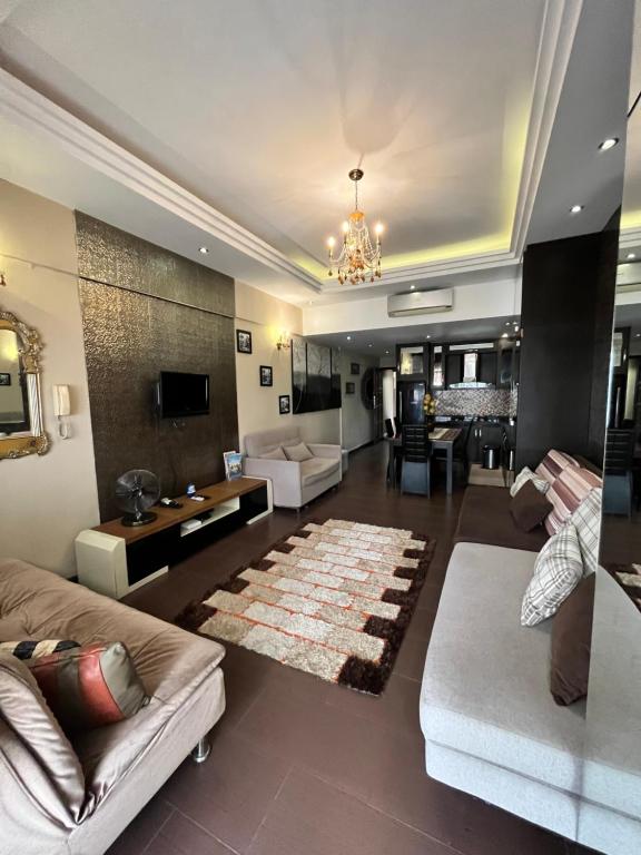 a large living room with a couch and a table at The Regency Tanjung Tuan Beach Resort Port Dickson in Port Dickson