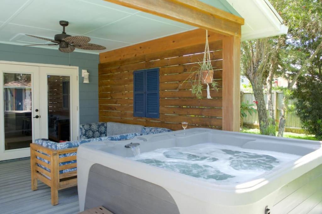 a jacuzzi tub on a deck with at Captains Quarters Island location Hot tub One Level in St. Augustine