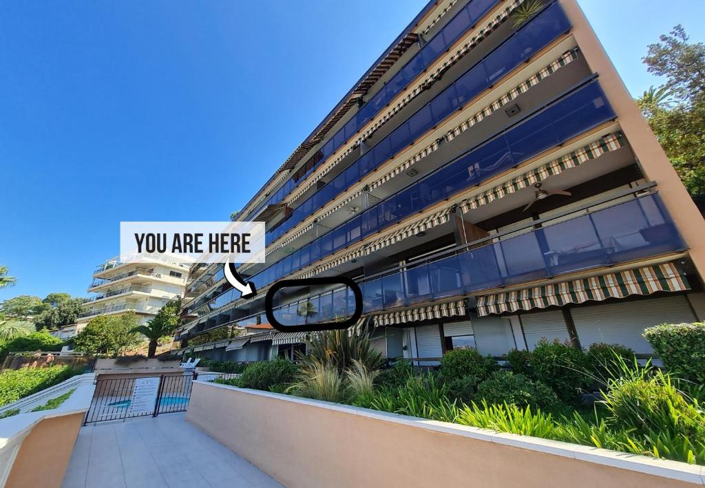 a building with a sign that reads you are here at Nestor&amp;Jeeves - HUBLOT TERRASSE - Sea view - swimming pool in Nice