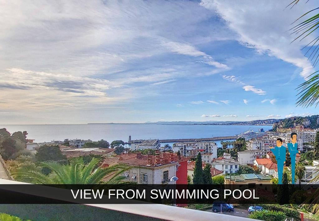 a view of the city and the ocean from swimming pool at Nestor&amp;Jeeves - HUBLOT TERRASSE - Sea view - swimming pool in Nice