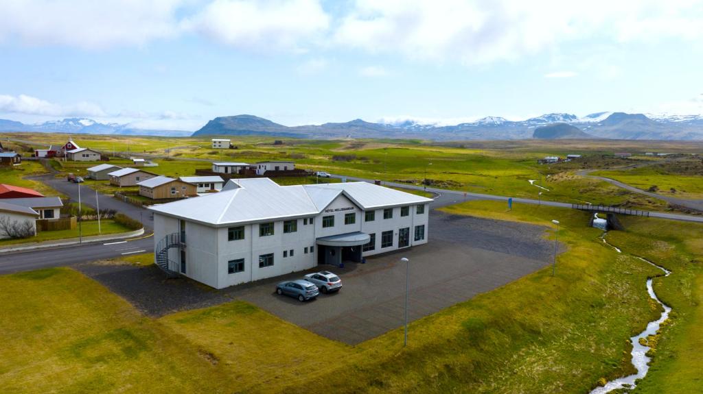 an overhead view of a white house with a car parked in front at Adventure Hotel Hellissandur in Hellissandur