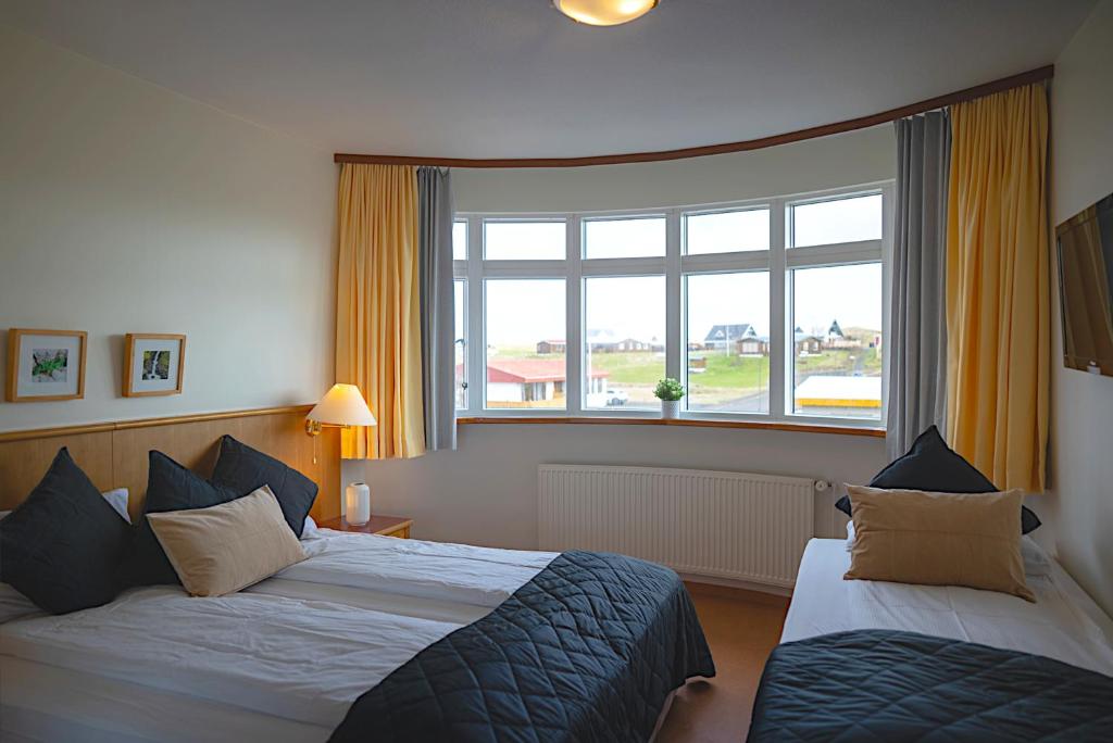 Postel nebo postele na pokoji v ubytování Adventure Hotel Hellissandur