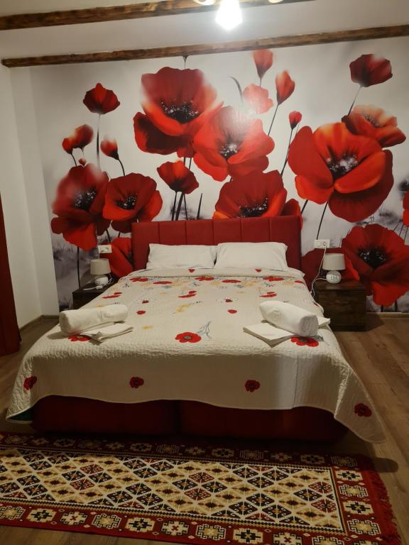 Postel nebo postele na pokoji v ubytování Conacul Ancuței